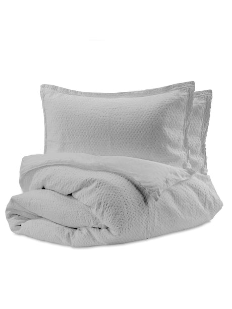 Housse de couette Nina en coton matelassé motif nid d’abeilles couleur gris béton, avec caches-oreillers